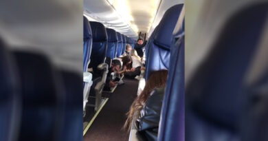 Flyers Crouch Below Seats, Child Cries As Gunfire Rages Outside